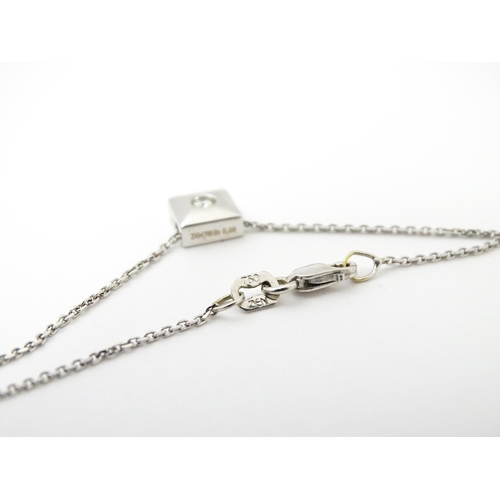 759 - An 18ct white gold chain necklace with diamond set pendant together with matching stud earrings. nec... 