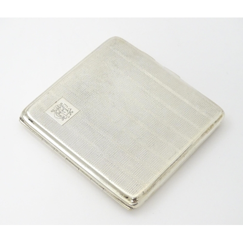 243 - A silver cigarette case with engine turned decoration and gilded interior, hallmarked Birmingham 192... 