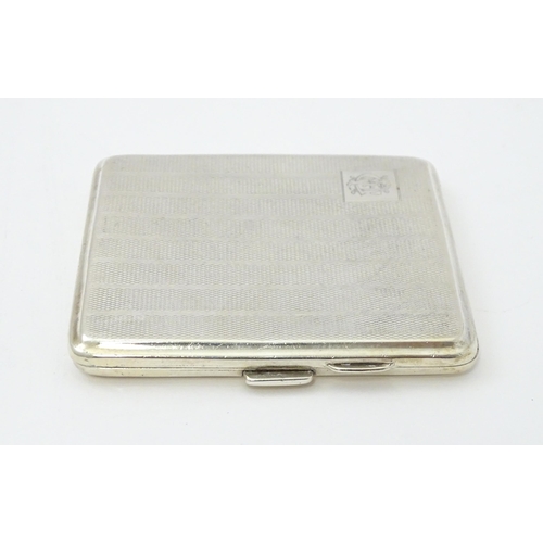 243 - A silver cigarette case with engine turned decoration and gilded interior, hallmarked Birmingham 192... 