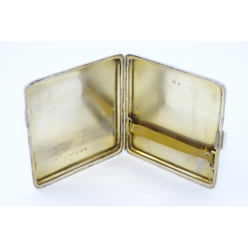 243 - A silver cigarette case with engine turned decoration and gilded interior, hallmarked Birmingham 192... 