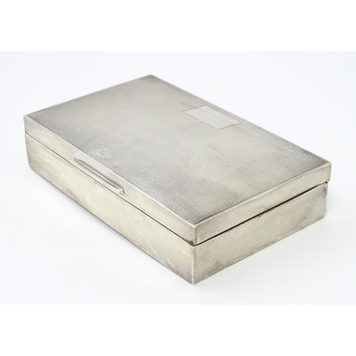 348 - A silver table top cigarette box with engine turned decoration hallmarked Birmingham 1961, maker Fre... 