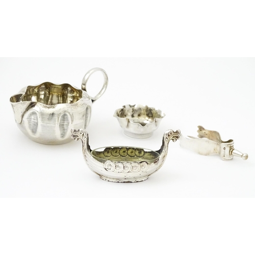 352 - Assorted silver items to include a silver cream jug hallmarked Birmingham 1890 maker Stokes & Irelan... 