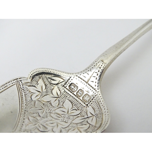 372 - Assorted items to include a Victorian silver preserve spoon hallmarked Birmingham 1896, a Victorian ... 