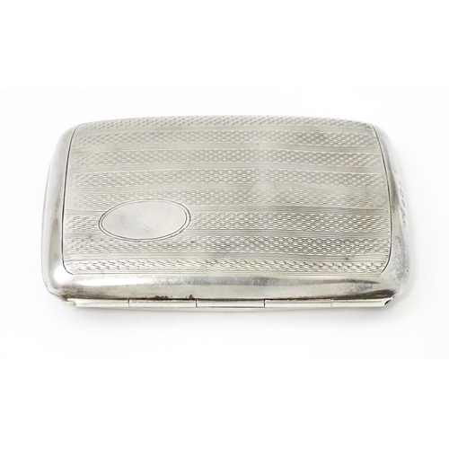 382 - A silver cigarette case opening to reveal faux tortoiseshell lining within. Hallmarked Birmingham 19... 