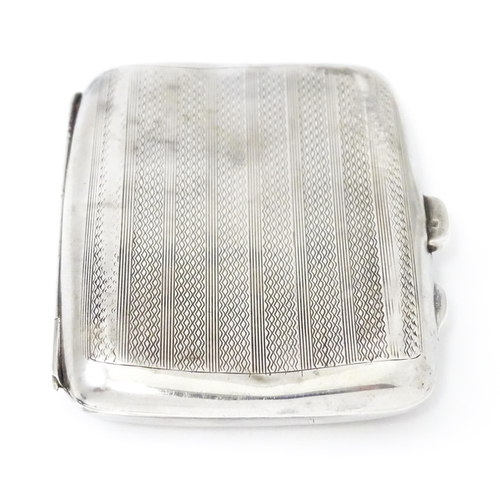 382 - A silver cigarette case opening to reveal faux tortoiseshell lining within. Hallmarked Birmingham 19... 