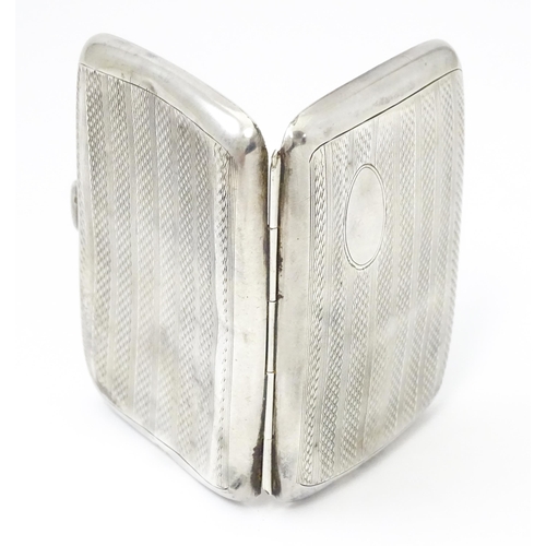 382 - A silver cigarette case opening to reveal faux tortoiseshell lining within. Hallmarked Birmingham 19... 