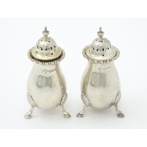 383 - A pair of silver peppers hallmarked Chester 1911, maker Jay, Richard Attenborough Co Ltd. Approx. 3 ... 