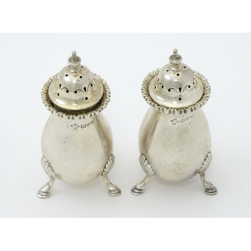 383 - A pair of silver peppers hallmarked Chester 1911, maker Jay, Richard Attenborough Co Ltd. Approx. 3 ... 