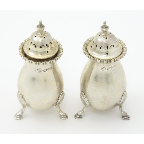 383 - A pair of silver peppers hallmarked Chester 1911, maker Jay, Richard Attenborough Co Ltd. Approx. 3 ... 