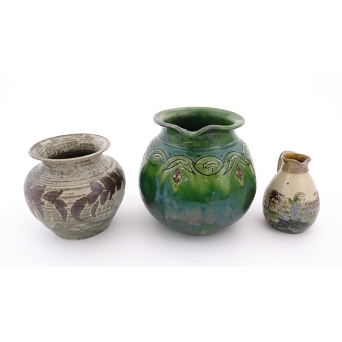 103 - Three assorted studio pottery items comprising a Spanish jug with banded detail marked Gongora Ubeda... 