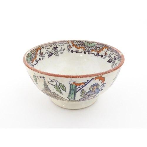 72 - A Scottish bowl with Chinoiserie depicting figures in a landscape. Possibly Bell's Pottery. Approx. ... 