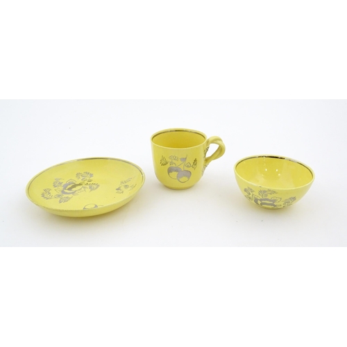 75 - A quantity of Leeds Pottery tea wares with a yellow ground decorated in silver lustre with foliage a... 