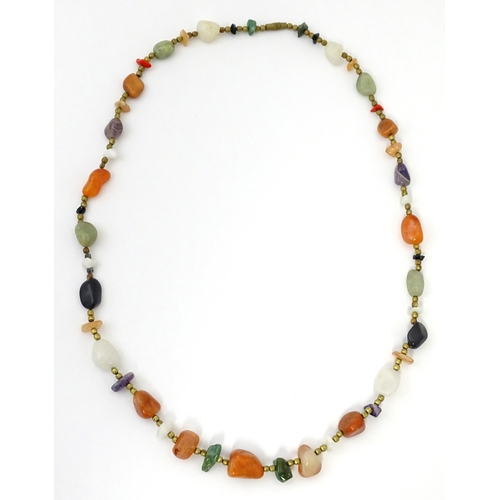 760 - A bead necklace with various hardstone beads. Approx 26