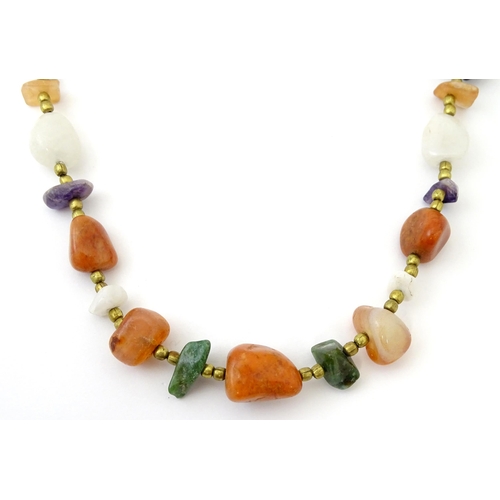 760 - A bead necklace with various hardstone beads. Approx 26