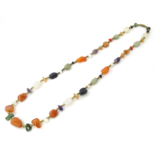 760 - A bead necklace with various hardstone beads. Approx 26