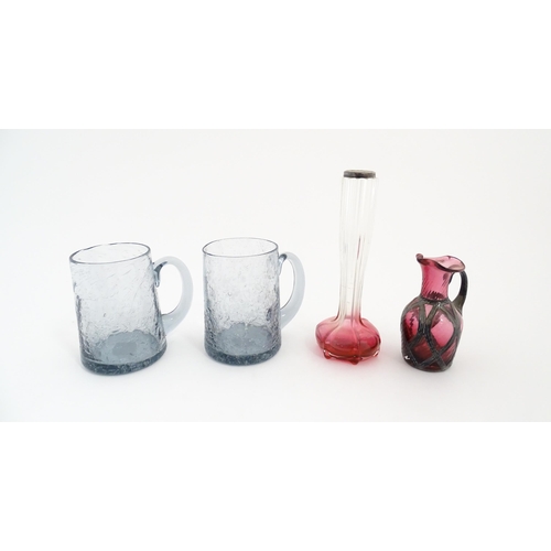 184 - A pair of glass mugs / tankards together with an Art Nouveau cranberry to clear glass bud vase with ... 