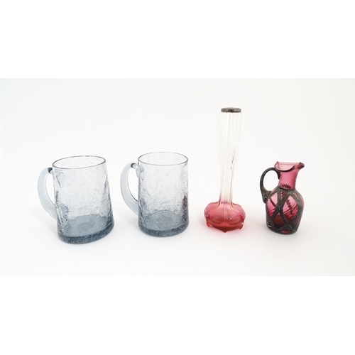 184 - A pair of glass mugs / tankards together with an Art Nouveau cranberry to clear glass bud vase with ... 