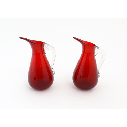 187 - Two Whitefriars ruby glass jugs. Together with a studio glass bowl with controlled bubble detail . J... 