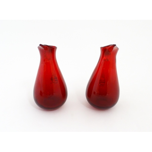 187 - Two Whitefriars ruby glass jugs. Together with a studio glass bowl with controlled bubble detail . J... 