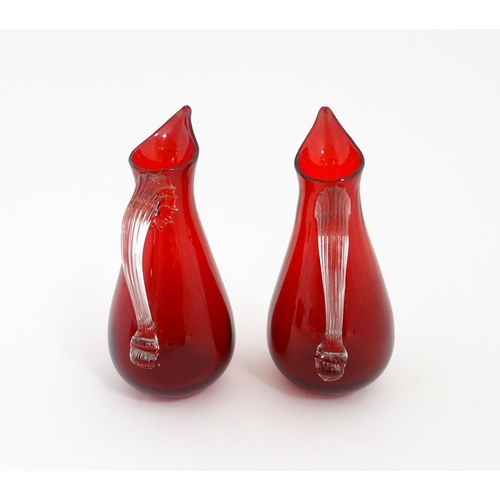 187 - Two Whitefriars ruby glass jugs. Together with a studio glass bowl with controlled bubble detail . J... 