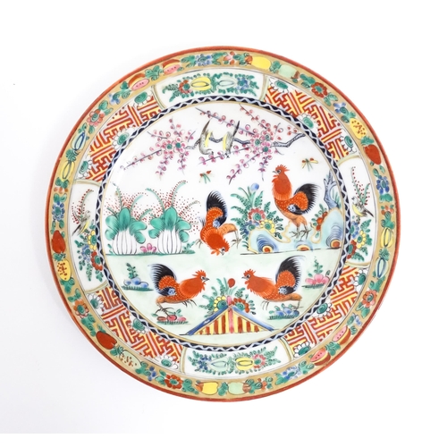 58 - A quantity of Chinese famille verte wares decorated with cockerels / roosters, flowers, tree blossom... 