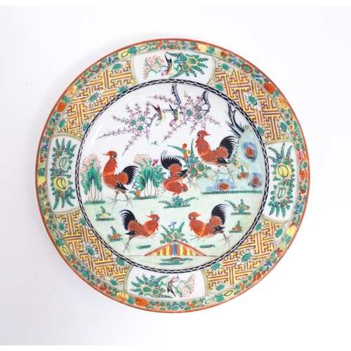 58 - A quantity of Chinese famille verte wares decorated with cockerels / roosters, flowers, tree blossom... 