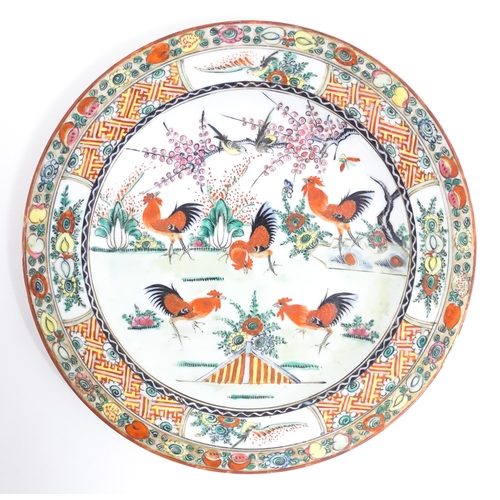 58 - A quantity of Chinese famille verte wares decorated with cockerels / roosters, flowers, tree blossom... 