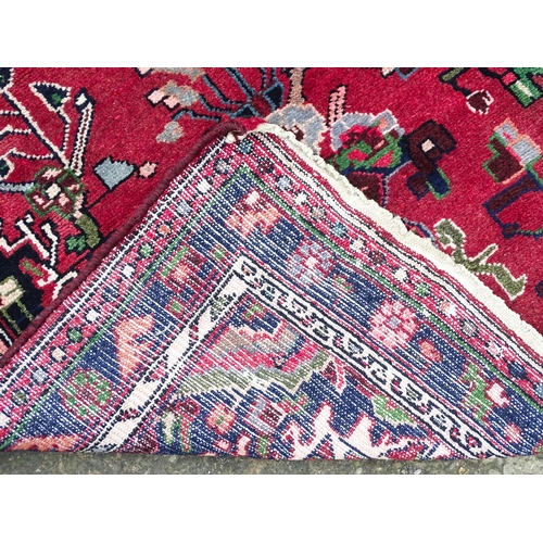 1381 - Carpet / Rug : A Persian Hamadan runner, the red ground with central cream ground medallion with flo... 