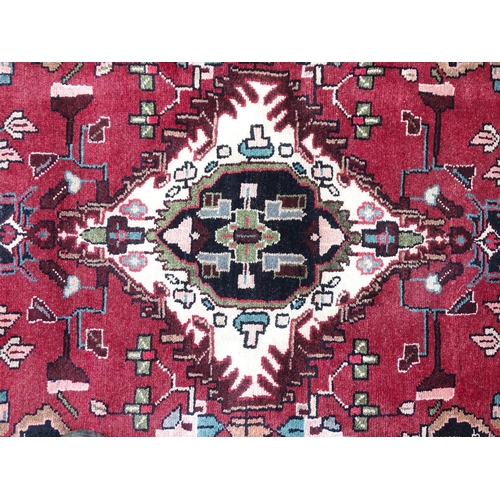 1381 - Carpet / Rug : A Persian Hamadan runner, the red ground with central cream ground medallion with flo... 