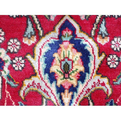 1395 - Carpet / Rug: A North West Persian Tabriz carpet the red ground with central cream and blue medallio... 