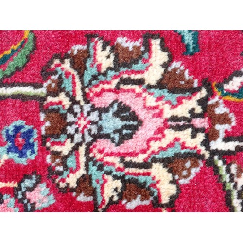 1395 - Carpet / Rug: A North West Persian Tabriz carpet the red ground with central cream and blue medallio... 