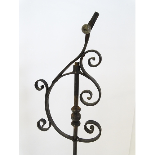 1410 - A 20thC standard lamp with triform base and foliate decoration. Together with two wrought iron style... 