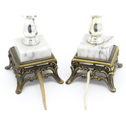 1413 - A matched pair of facet cut glass table lamps with marble detail to base. Approx. 11 1/4