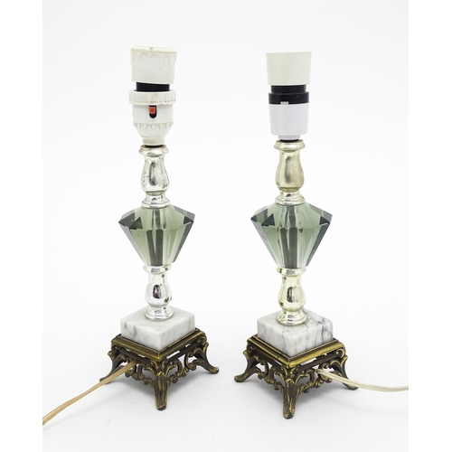 1413 - A matched pair of facet cut glass table lamps with marble detail to base. Approx. 11 1/4