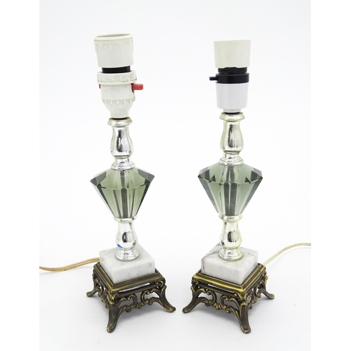 1413 - A matched pair of facet cut glass table lamps with marble detail to base. Approx. 11 1/4