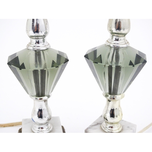 1413 - A matched pair of facet cut glass table lamps with marble detail to base. Approx. 11 1/4