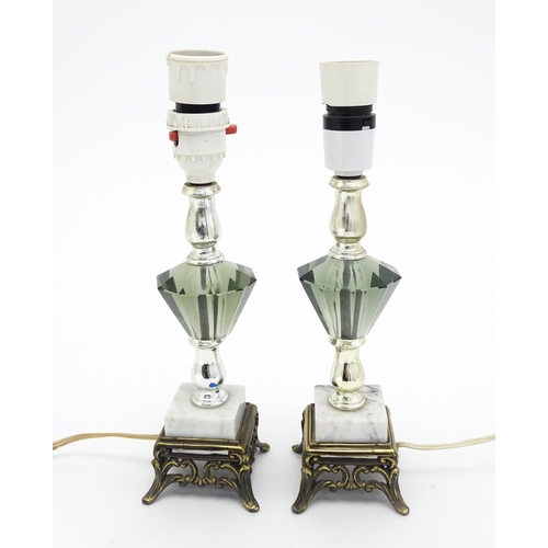 1413 - A matched pair of facet cut glass table lamps with marble detail to base. Approx. 11 1/4