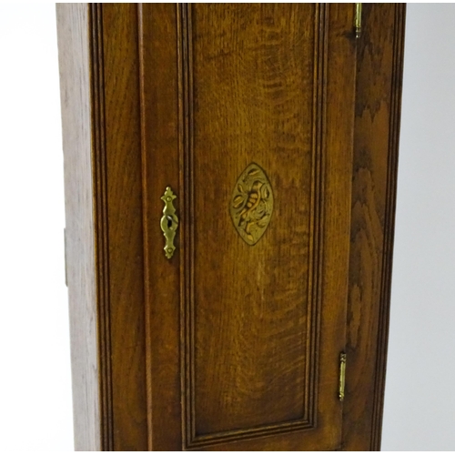 1433 - A 19thC oak cased 8-day longcase clock. The painted arch dial signed Foster  Guildford. The case wit... 