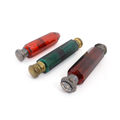 203 - Three various Victorian double ended scent flasks comprising two ruby glass and a green glass exampl... 