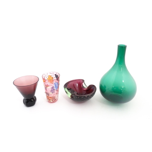 213 - Four items of glassware to include a green bottle vase, an ashtray with controlled bubble detail, a ... 