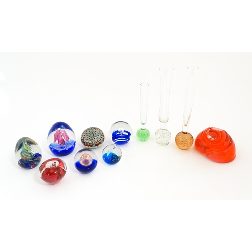 214 - A quantity of assorted art glass paperweights and vases, to include bud vases and a Murano style gla... 