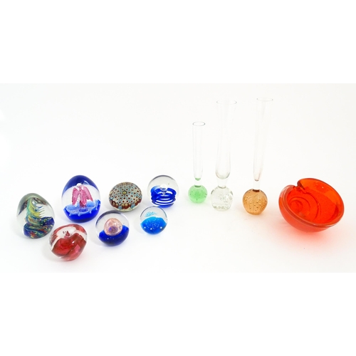 214 - A quantity of assorted art glass paperweights and vases, to include bud vases and a Murano style gla... 