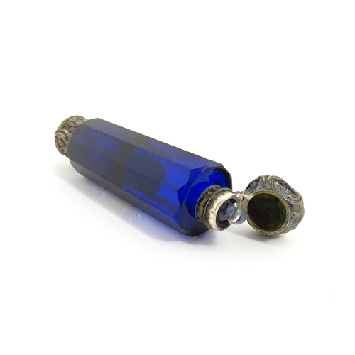 219 - A glass scent / perfume bottle with blue flash cut decoration. Together with a Bristol blue coloured... 