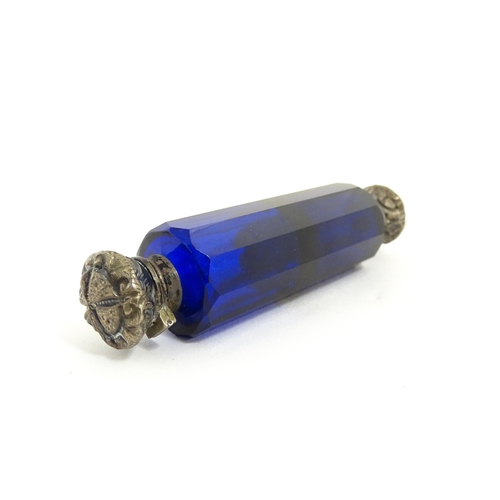 219 - A glass scent / perfume bottle with blue flash cut decoration. Together with a Bristol blue coloured... 