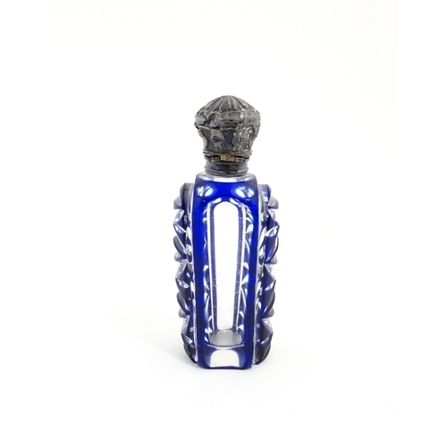 219 - A glass scent / perfume bottle with blue flash cut decoration. Together with a Bristol blue coloured... 