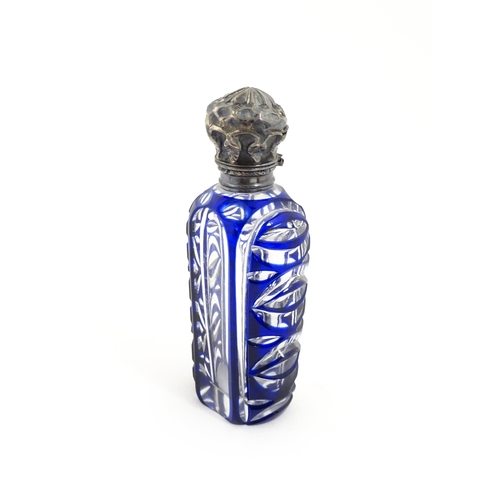 219 - A glass scent / perfume bottle with blue flash cut decoration. Together with a Bristol blue coloured... 