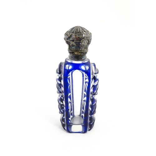 219 - A glass scent / perfume bottle with blue flash cut decoration. Together with a Bristol blue coloured... 