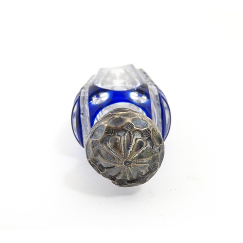 219 - A glass scent / perfume bottle with blue flash cut decoration. Together with a Bristol blue coloured... 