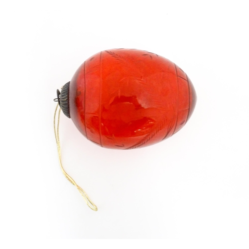 235 - Christmas decorations : Three red glass baubles with engraved detail. Largest approx. 6