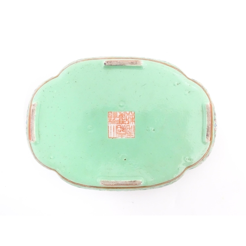 24 - A Chinese famille rose dish with scrolling floral and foliate decoration. Character marks under. App... 